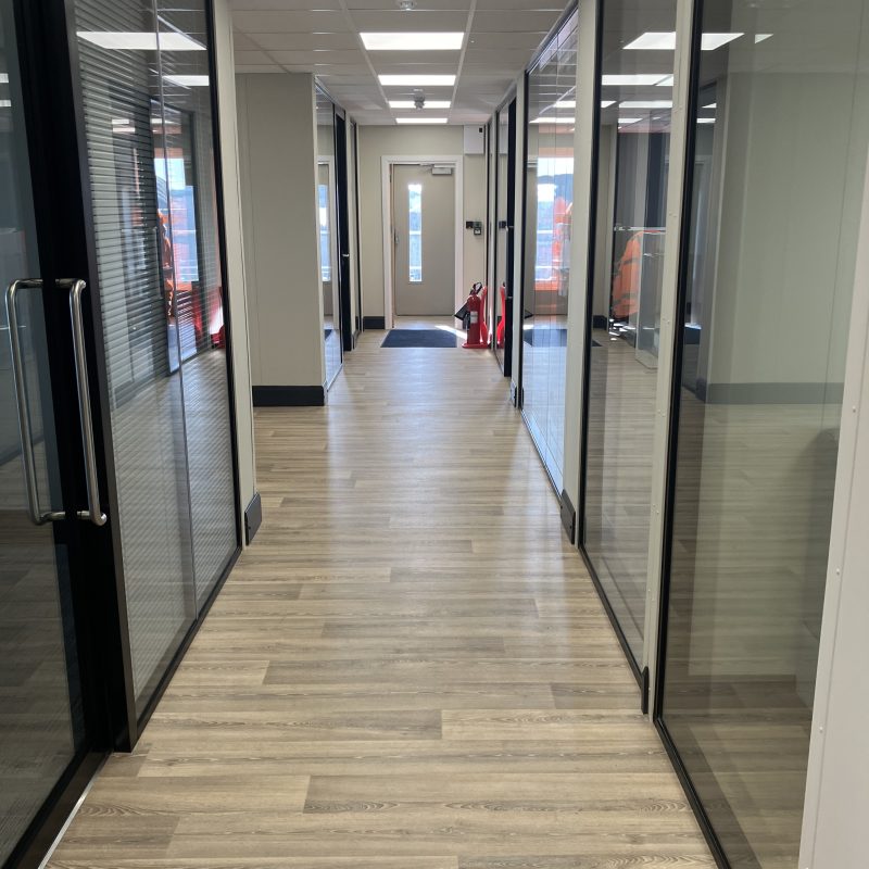 Interior fit-out of modular office building with glass partitions